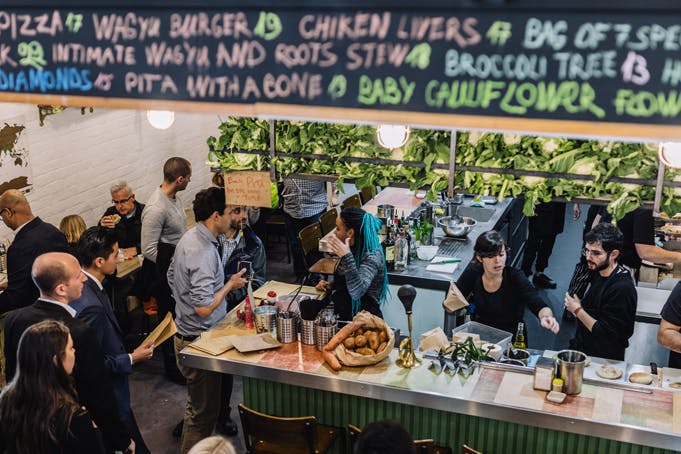 A busy restaurant with people lining up for some of the best middle eastern restaurant Melbourne food.